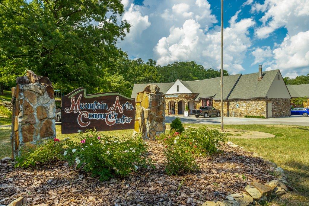 Photo of the entrance to the Mountain Arts Center on Signal Mountain Tn with sign in the front and building in the background.