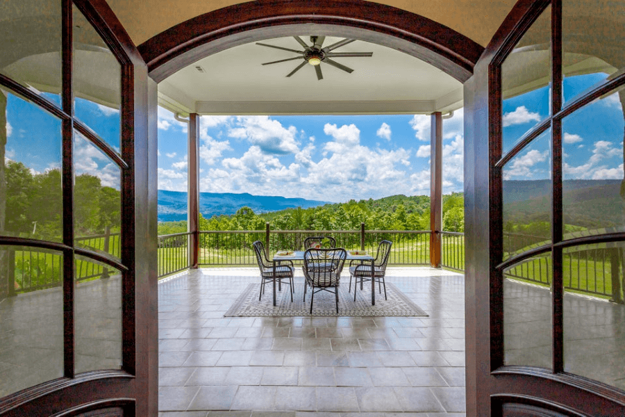 Row of Chattanooga Luxury Real Estate Picture of beautiful outdoor landscape through double French doors.
