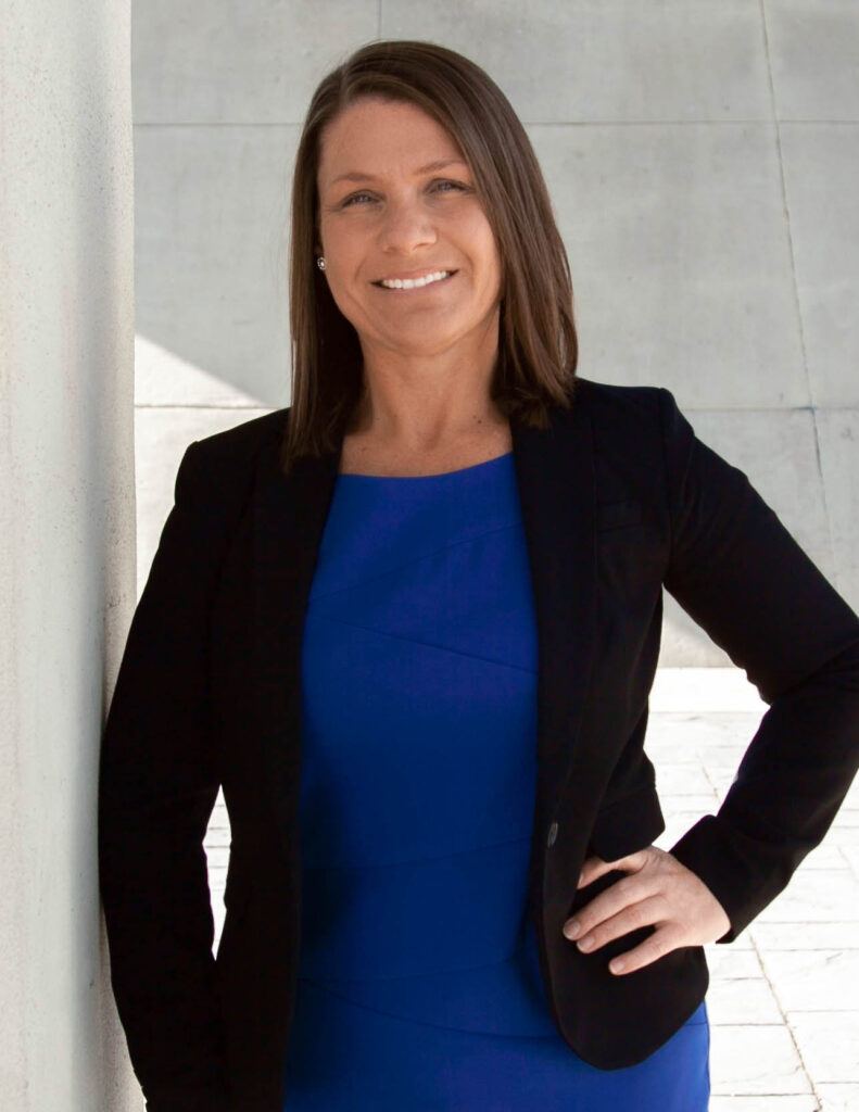 Head shot of Shannon Morlan Your Chattanooga Realtor with Legal expertise.  In Blue dress with black jacket