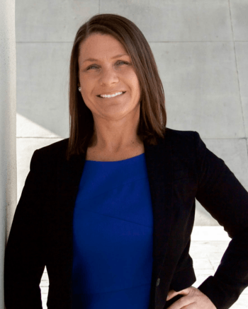 Head shot of Shannon Morlan Your Chattanooga Realtor with Legal expertise. In Blue dress with black jacket