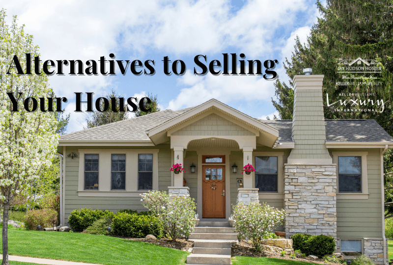 Header image for Alternatives to selling your house. Beige home with front porch and wooden door on hill.