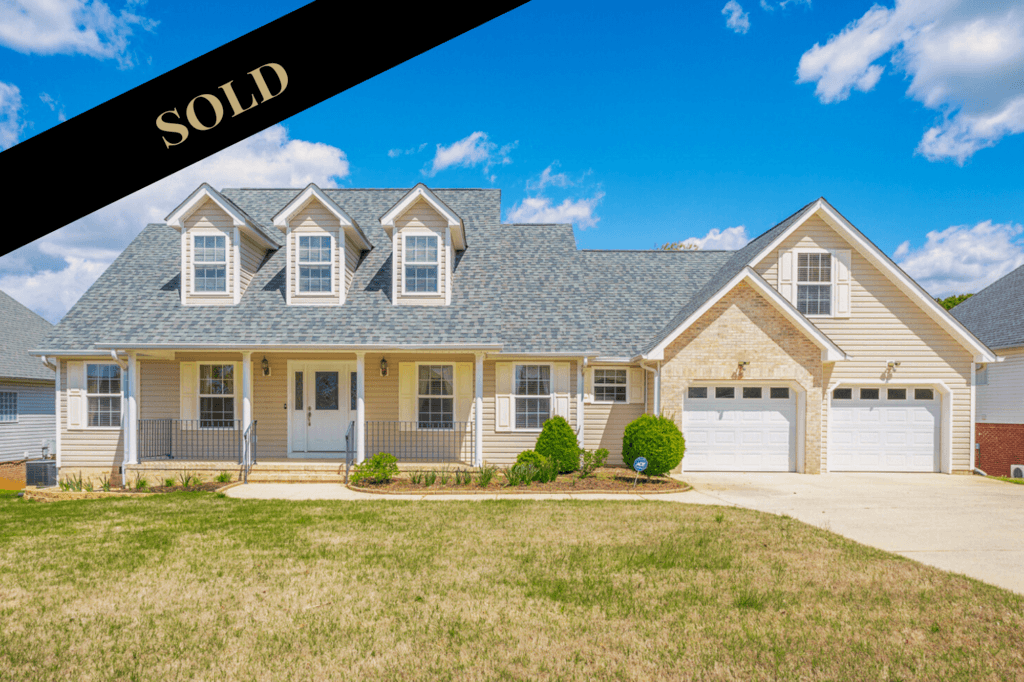 Front of 103 Blue Heron Dr a two story home with front porch.  Sold