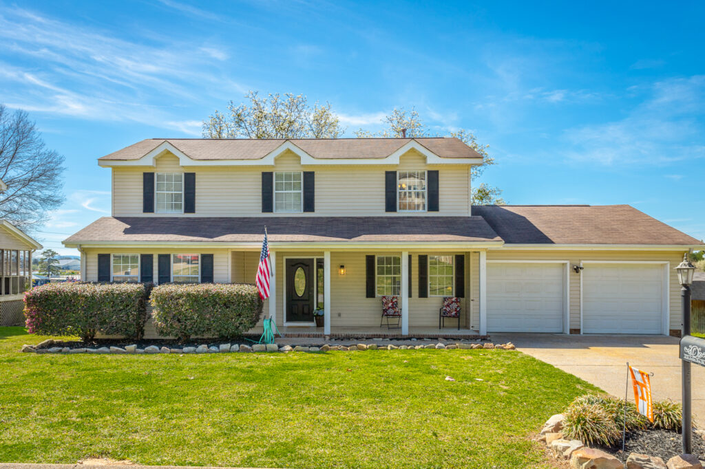 front of 6736 Jordan Run a traditional 2 story home with front porch and 2 car garage