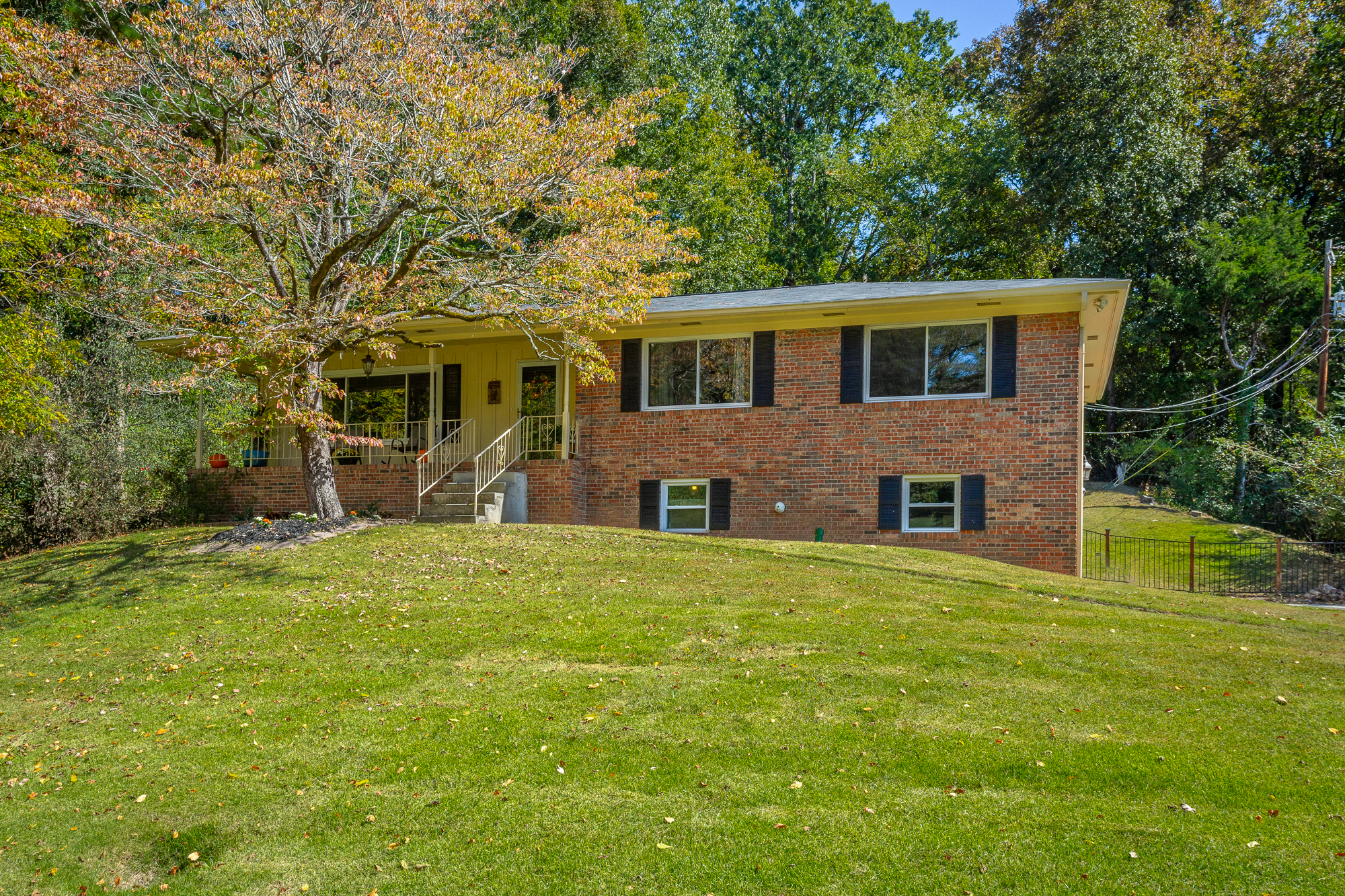 Front of 2316 Meadowbrook Trail a brick home with garage a basement level